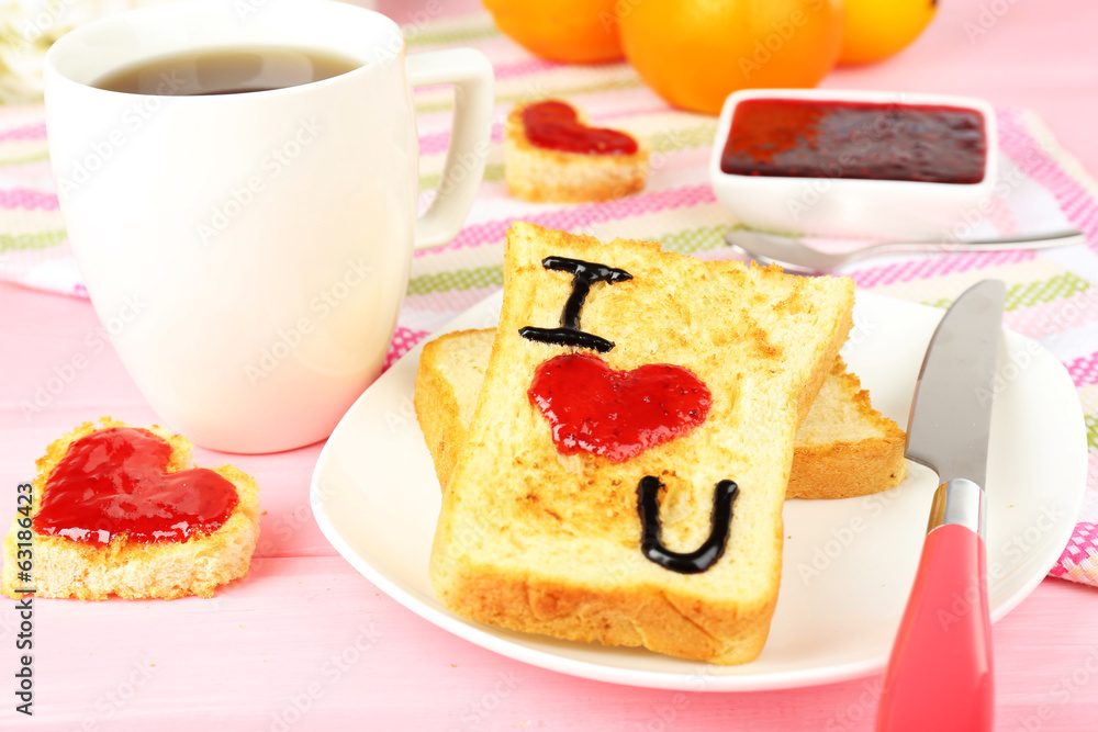 Delicious toast with jam and cup of tea on table close-up - obrazy, fototapety, plakaty 
