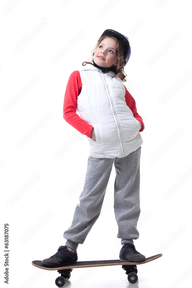 Naklejka premium Merry little skateboarder posing looking up
