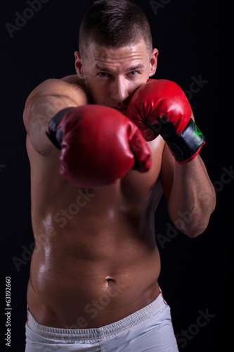 muscular boxer with red gloves © V&P Photo Studio
