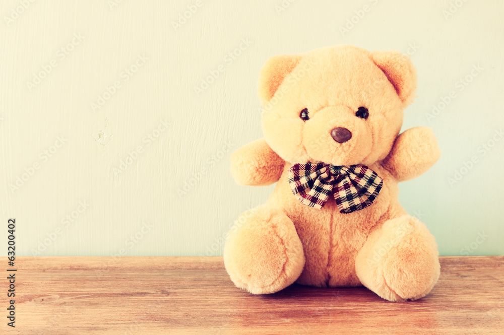 teddy bear on wooden table teddy bear on wooden table
