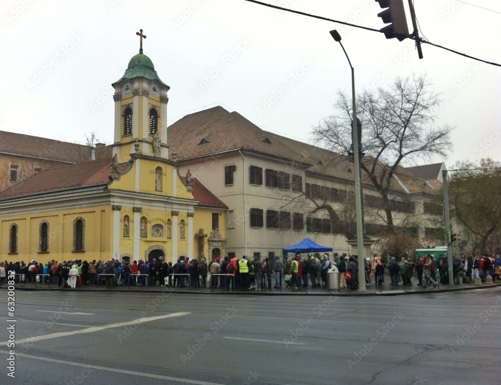 Fototapeta premium Que of homeless waiting of free food, Budapest