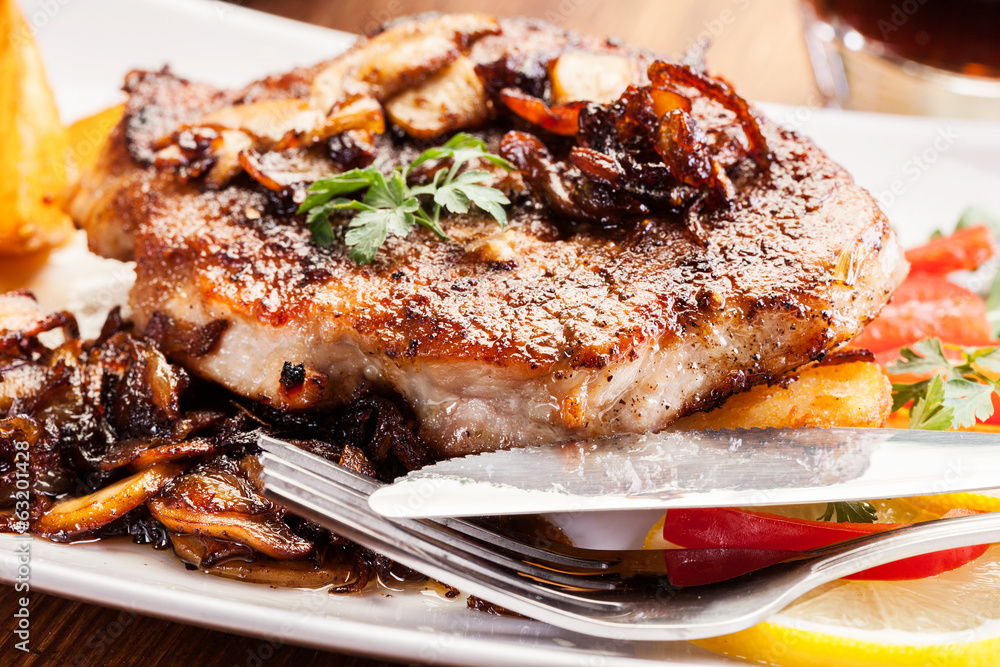 Fried pork chop with mushrooms and chips Fried pork chop with mushrooms and chips