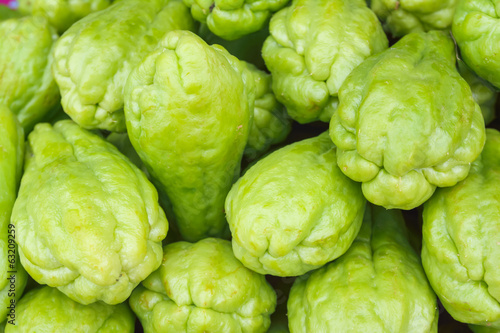 Pile chayote fresh vegetables on the market photo