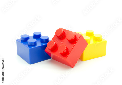 Plastic building blocks on white background