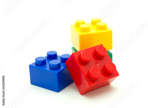 Plastic building blocks on white background