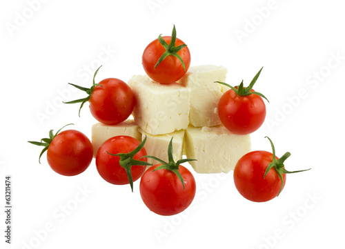 Cherry tomatoes and Greek cheese. Isolated on white