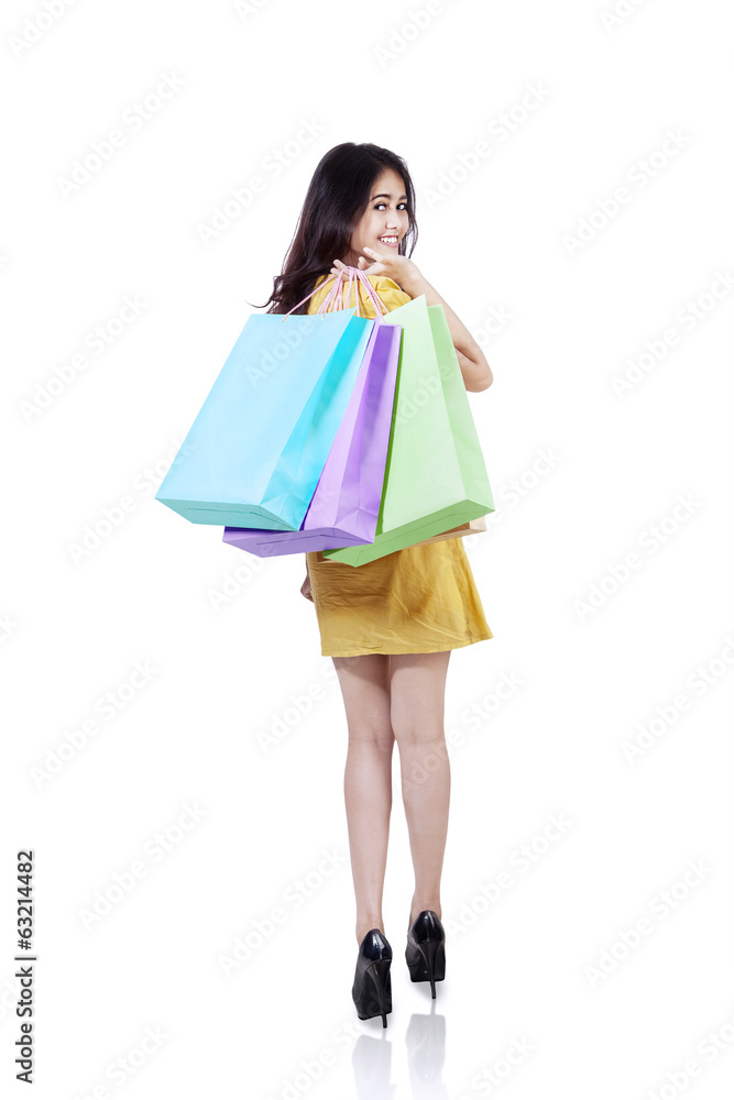 Happy shopper with shopping bags isolated Happy shopper with shopping bags isolated