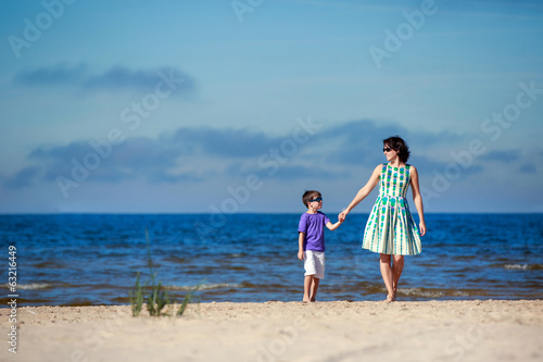 Young mother and her son on summer vacation