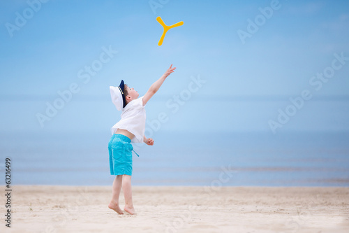 Photography Happy little boy playing on tropical beach