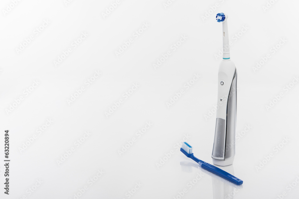 Dental Health Concept: Electric Toothbrush Against Manual Toothb Dental Health Concept: Electric Toothbrush Against Manual Toothb