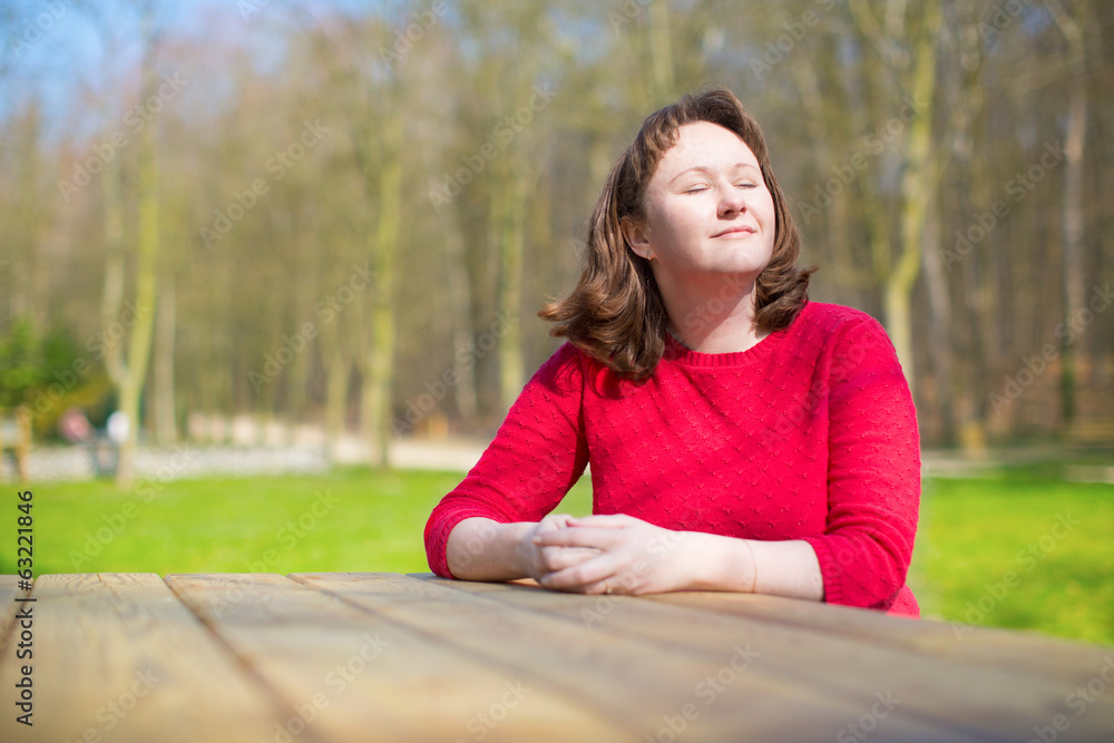 Woman enjoying warm weather in park Woman enjoying warm weather in park