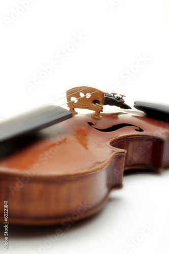 Detail of old scratched violin, isolated on white background.