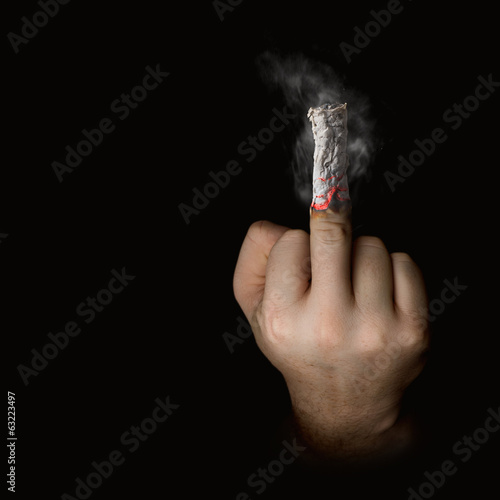 stop smoking concept. cigarette like a middle finger