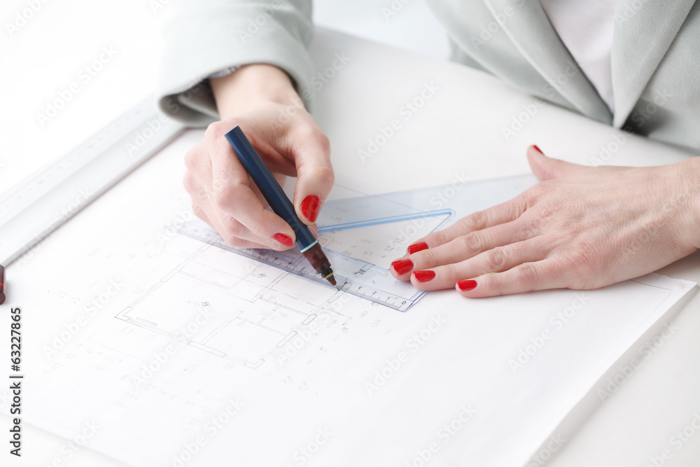 Architect working on blueprint Architect working on blueprint