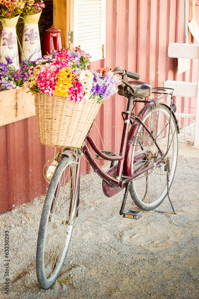 Vintage bicycle with flower in basket