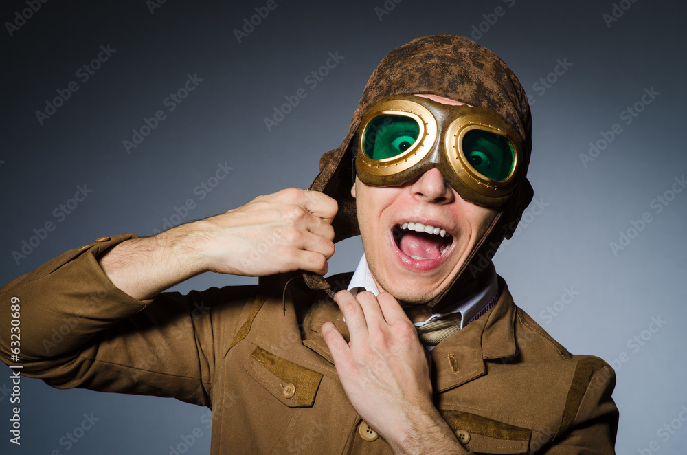 Funny pilot with goggles and helmet Funny pilot with goggles and helmet