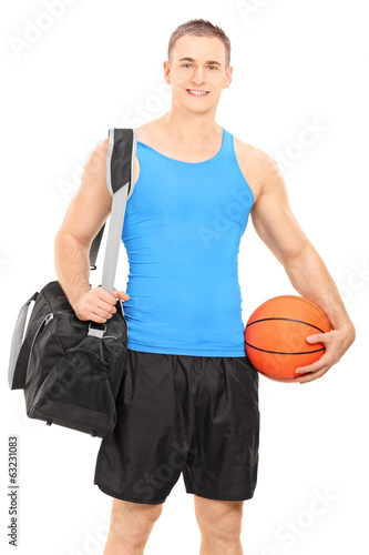 Male basketball player carrying a sports bag