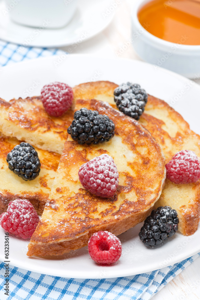 French toast with fresh berries and powdered sugar, vertical French toast with fresh berries and powdered sugar, vertical