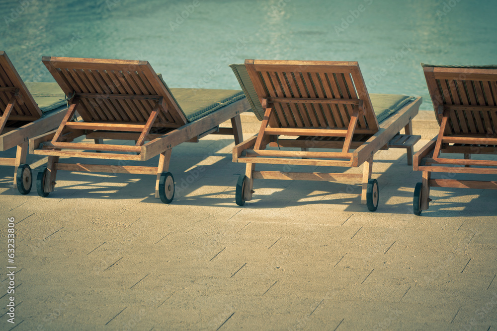 Fototapeta premium Hotel Poolside Chairs with Sea view