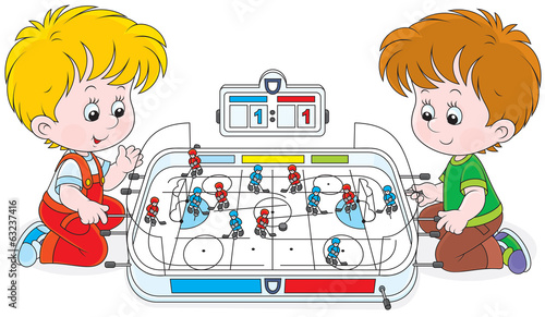 Kids playing table hockey