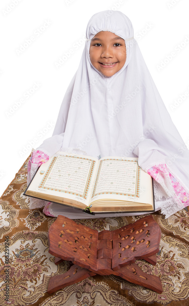 Young girl reading the Holy Quran Royalty-Free Stock Image - Storyblocks