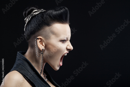 Photography angry young woman screaming isolated on black background with co