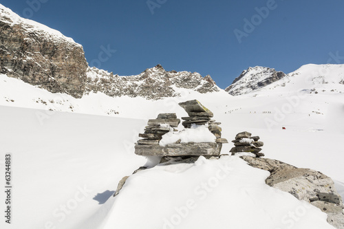 Pyramid build from stones on a mountain slope photo