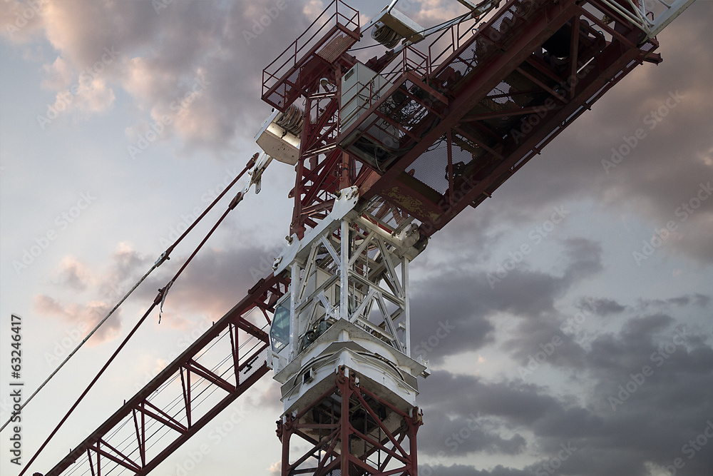 Industrial red crane, sunset background, construction and works Industrial red crane, sunset background, construction and works