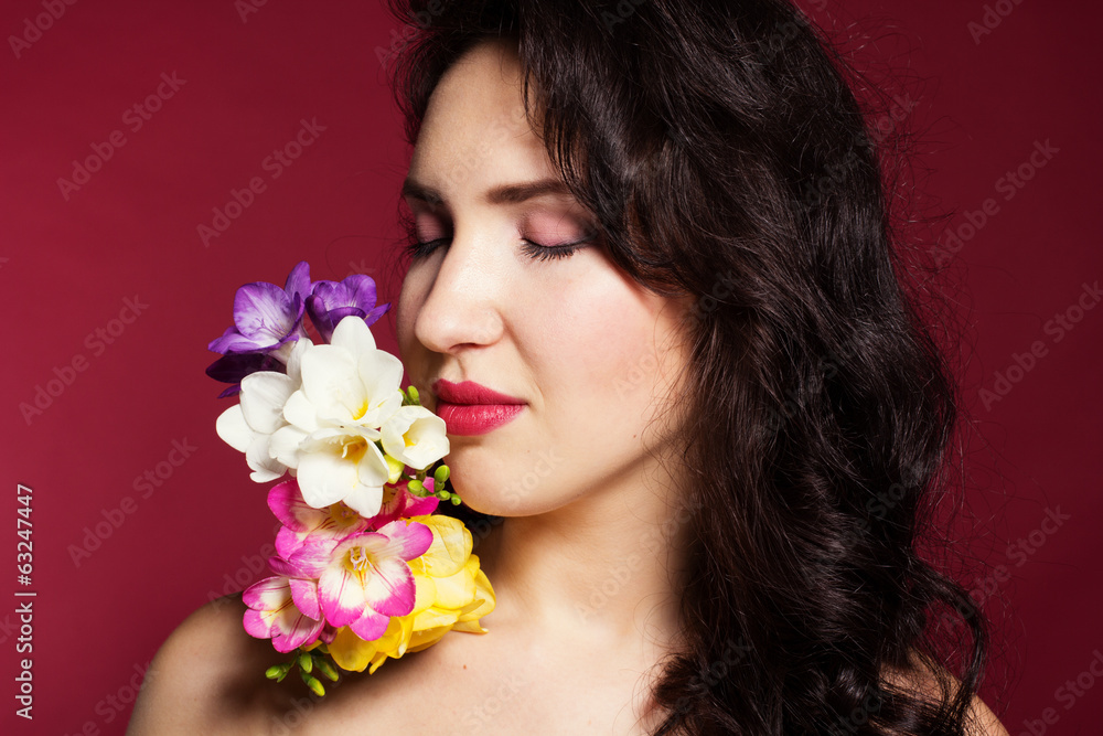 Pretty brunette lady with fresia flowers Pretty brunette lady with fresia flowers