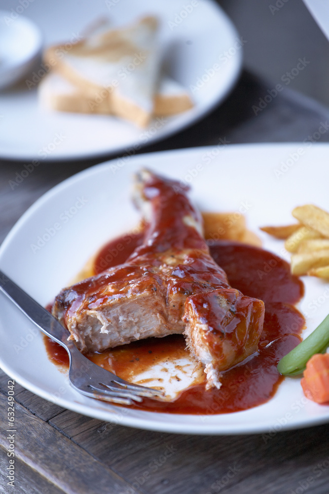 pork steak and tomato sauce in sun light