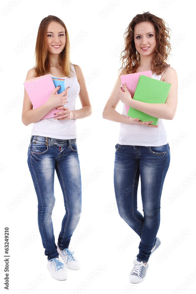 Beautiful young women holding books isolated on white Beautiful young women holding books isolated on white