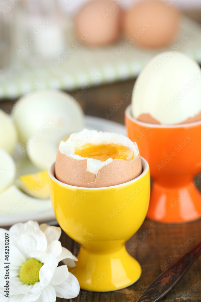 Boiled eggs on color wooden table, on bright background Boiled eggs on color wooden table, on bright background