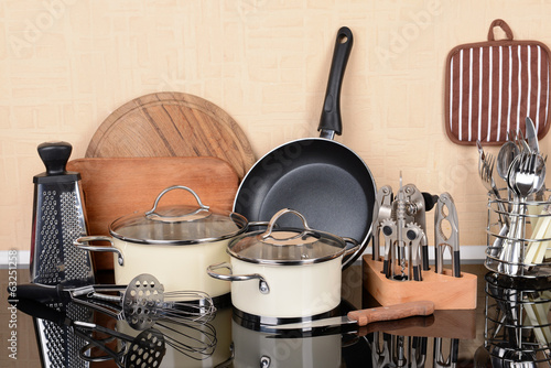 Foto Kitchen tools on table in kitchen