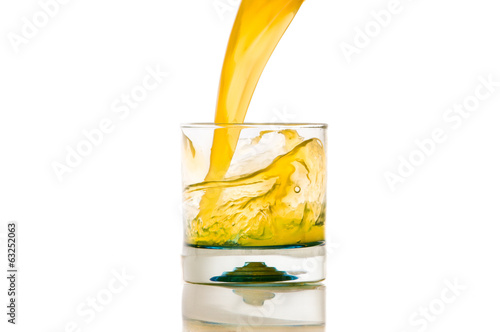 pouring orange juice splash on a white background