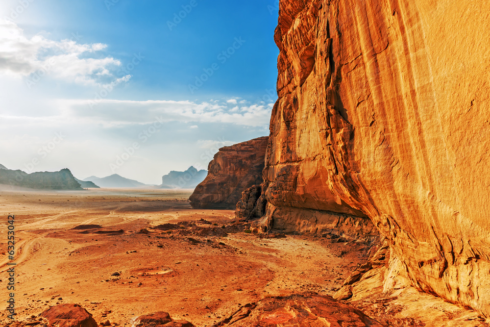 Red sandstone cliff in the desert of Wadi Rum - obrazy, fototapety, plakaty 