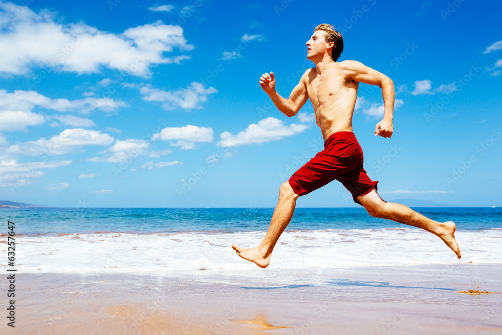 Athletic Man Running on Beach