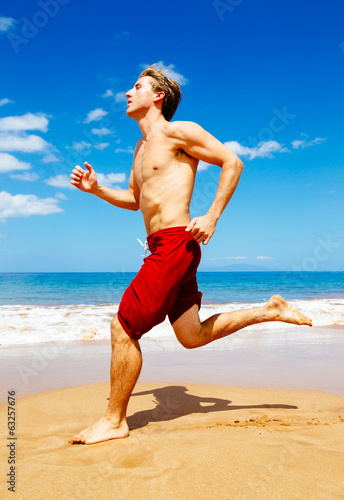 Athletic Man Running on Beach