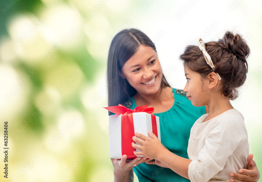 happy mother and child girl with gift box happy mother and child girl with gift box