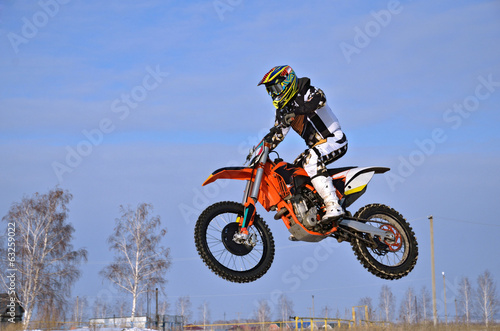 Motocross racer performs a jump efficient