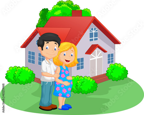 Young couple in front of their house