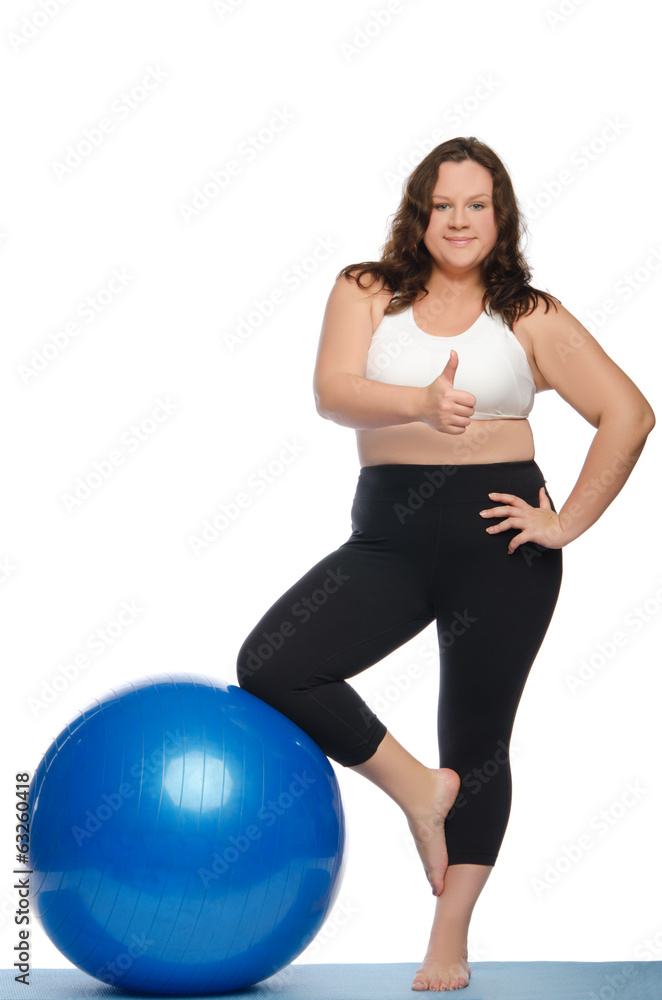 Happy woman with excess weight and ball Happy woman with excess weight and ball