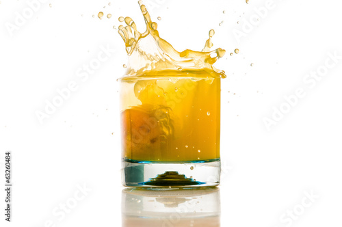 pouring orange juice splash on a white background