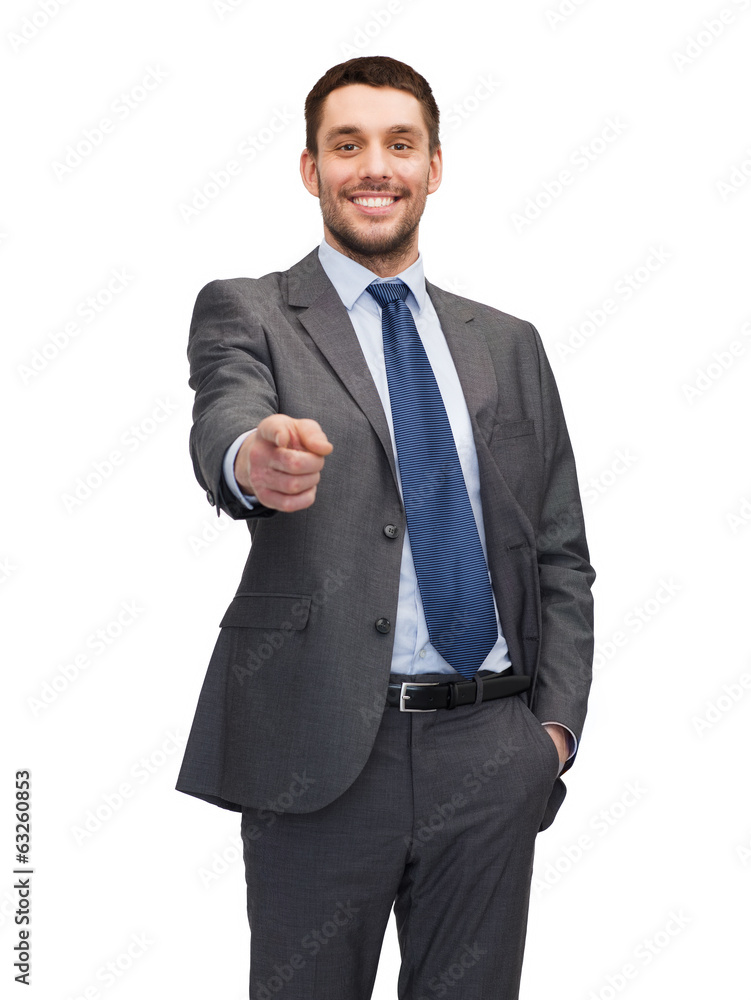 handsome buisnessman pointing finger at you handsome buisnessman pointing finger at you