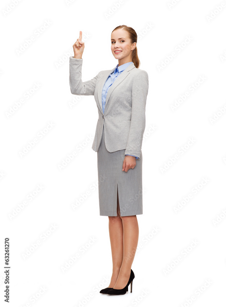 smiling businesswoman with her finger up smiling businesswoman with her finger up