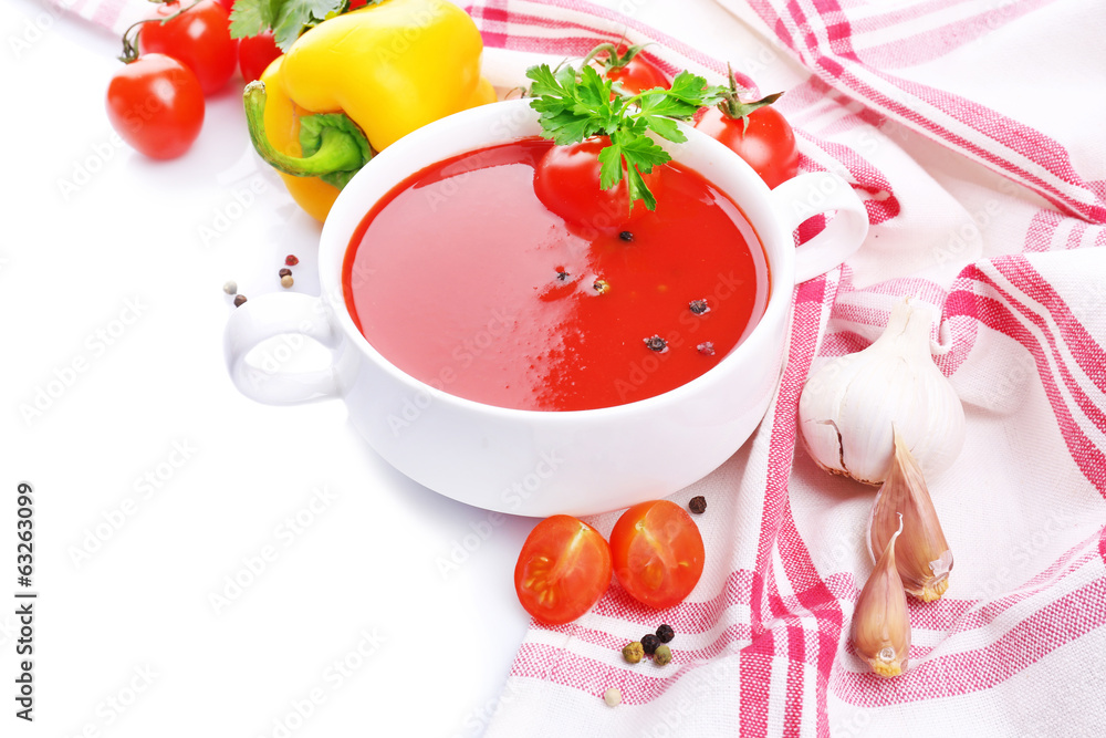 Tasty tomato soup and vegetables, isolated on white Tasty tomato soup and vegetables, isolated on white