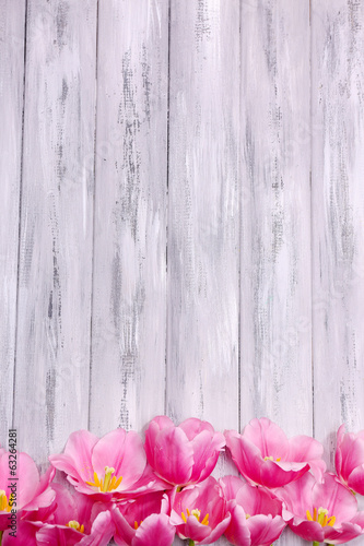 Fototapeta Naklejka Na Ścianę i Meble -  Beautiful flowers on color wooden background