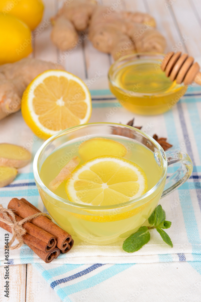 Healthy ginger tea with lemon and honey on table close-up Healthy ginger tea with lemon and honey on table close-up