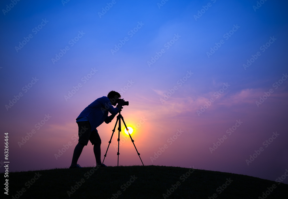 Silhouette of Photographer on Hill Top