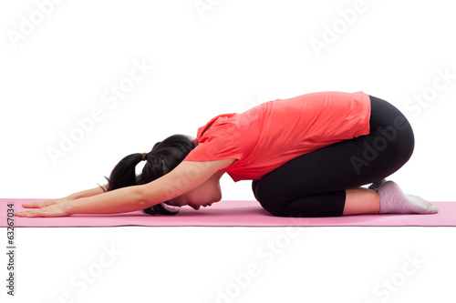 Woman doing yoga child pose