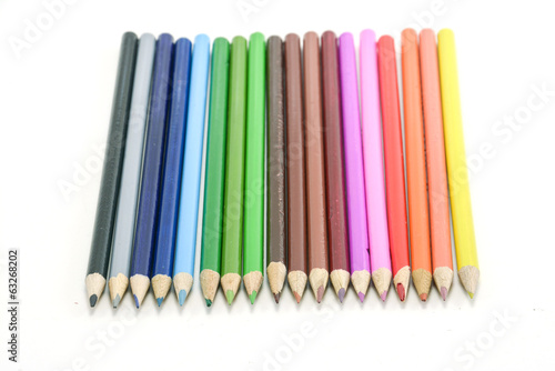 Colour pencils isolated on white background © Suwatchai